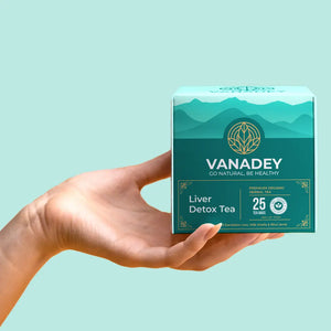 A hand holds a box of VANADEY Liver Detox Tea